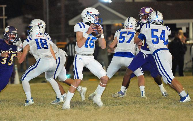 St. Edmund quarterback Kane West looks for a receiver.