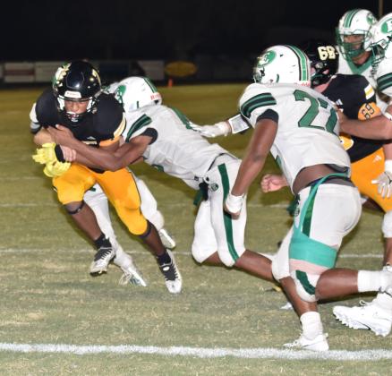 Eunice's Xavier Hebert and Lathan Kennedy stop Church Point's Tyrese Boast at the goal line.
