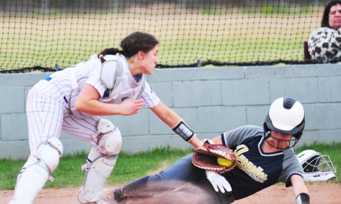 Alice Brown makes a tag at the plate.
