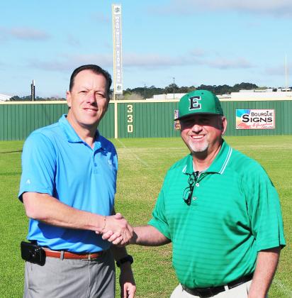 Washington State Bank’s Kip Bertrand joins Eunice High head coach Scott Phillips prior to the annual baseball tournment.