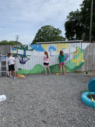 Painting place mats at Eunice Community Sensory Garden