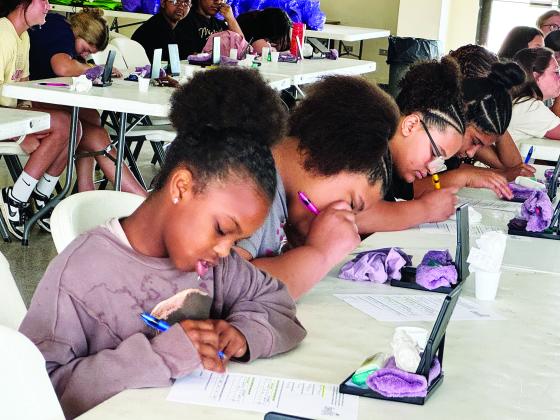 Girls working on crafts
