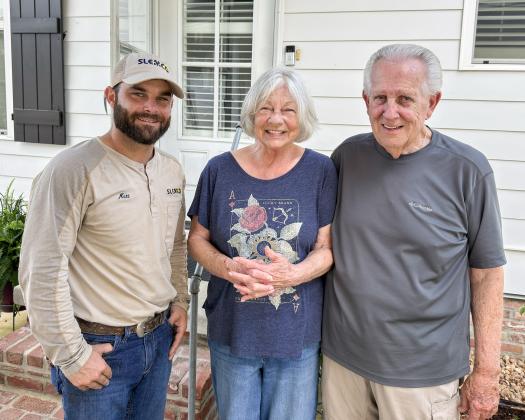 From left, SLEMCO lineman Matt Reed with homeowners Mary and Ron Oakley. (Submitted photo)