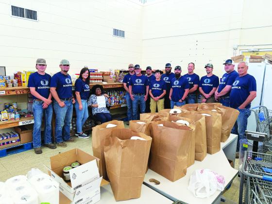 Boardwalk calls this their Week of Caring. They provide four hours of volunteer time with trusted nonprofit partners, offering a variety of ways to give back to the community. This is an annual event that Boardwalk plans to do for the Eunice Food Bank. (Photo by Rebecca Chaisson)