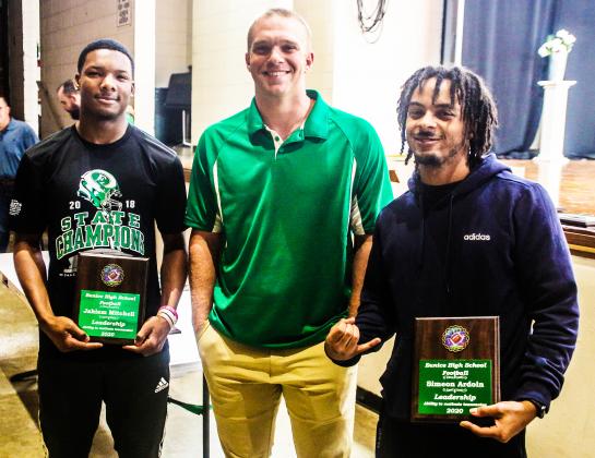 Eunice coach Stuart Turner gives the Leadership Award to  Jahiem Mitchell and Simeon Ardoin.