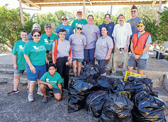 Cleanup volunteers in front of the Eunice Municipal Complex.