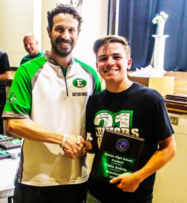 Eunice coach Chad Andrepont presents the scholastic award to Colin Ardoin.