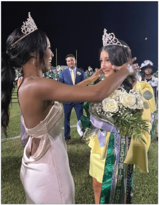 Outgoing 2024 Eunice High School Homecoming Queen Tyja Cooper, left, crowns 2025 Homecoming Queen Kaylee Fontenot as Fontenot’s father Justin Fontenot watches at back. EHS Homecoming was celebrated last week. (Submitted photo)