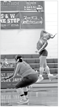 On Tuesday evening, the St. Edmund High volleyball team fell to Westminster Christian Academy Opelousas 15-25, 5-25, and 15-25. St. Ed senior Ava Smith goes for a spike during Tuesday’s loss to Westminster Christian Academy in district play. From left, are Reagan Gradney and Ava Smith. (Photo by Amy Myers)