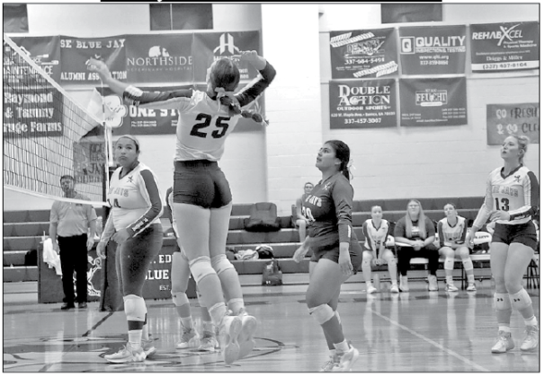 The St. Edmund High Volleyball team played Welsh High last week in their last regular season game. St. Edmund won 25-8, 25-15 and 25-16. St. Ed player Beth Miller sends the ball over. Looking on are Reagan Gradney, Seyda Deshotel and Ava Smith. (Photo by Amy Myers)