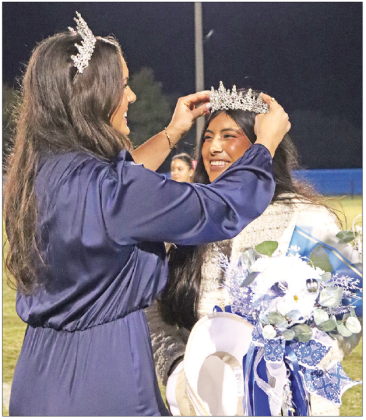 2024 St. Edmund Homecoming Queen Amelia “Millie” Miller crowns the new 2025 St. Edmund Homecoming Queen Seyda Deshotel during half time Friday evening. The Blue Jays won the big game against the Bolton Academy Bears 48-0. (Photo by Amy Myers)