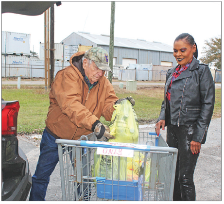 The Eunice Food Bank Food Drive was held Tuesday from 6 a.m. until 6 p.m. Many families, clubs, schools, churches, and civic organizations donated food items for the annual drive. From left are Allie Fontenot, a volunteer for many past years, and Angelia Guillory. (Photo by Myra Miller)