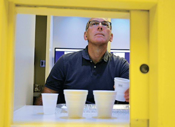 Bryan Gueltig, the Pesticide Safety Education Program coordinator for the LSU AgCenter, reacts to a taste test question after drinking coffee during a study at the Sensory Services Laboratory. Photo by Kyle Peveto/LSU AgCenter