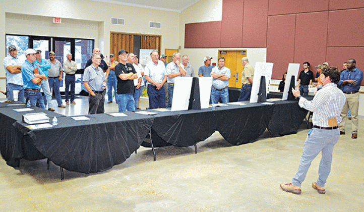 Andy Taylor, senior manager in development for Lightsource bp,addresses a larger-than-expected crowd of area farmers and citizens at the LSU AgCenter Building Wednesday concerning a proposed 1,100-acres solar farm to be located north of Crowley along La. 13. (Photos by Steve Bandy/Crowley Post-Signal)