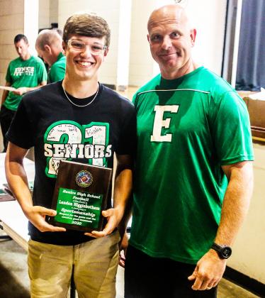 Eunice coach Dale Guillory presents the Sportsmanship Award to Landen Higginbotham and Jeoul HIll (not pictured)