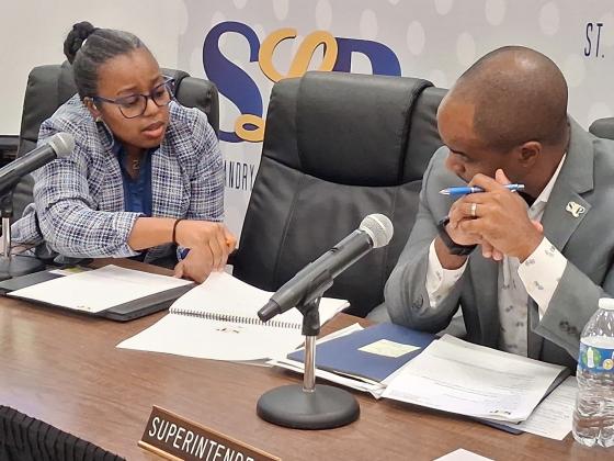 St. Landry Parish school board member Bianca Vedell poses budget questions to superintendent Milton Batiste III following the thursday night meeting