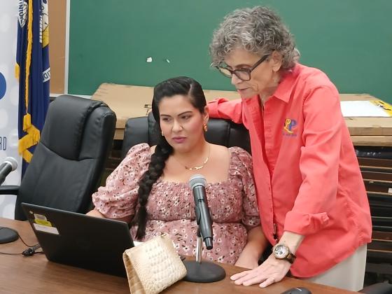 Tiffany Nolan and Mary Ellen Donatto look at the budget