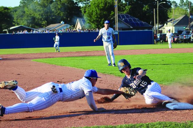 St. Edmund Ben Miller attempts an out at 3rd. (Photo by Amy Myers)