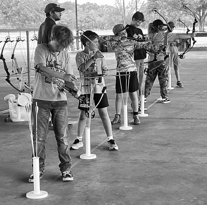 Children practicing archery