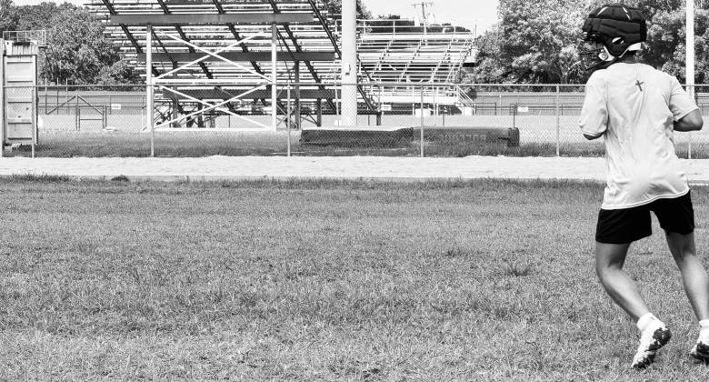 Carson throwing football