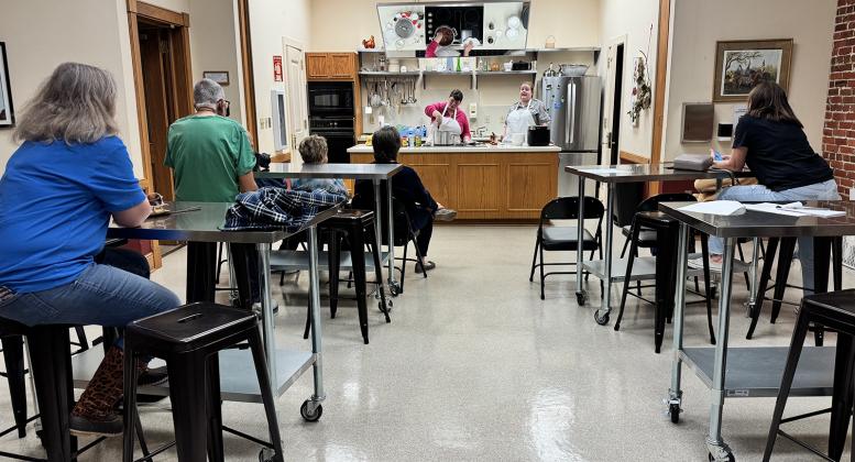 Audience at Jean Lafitte Center watching cooking class. (Photos by Rebecca Chaisson)