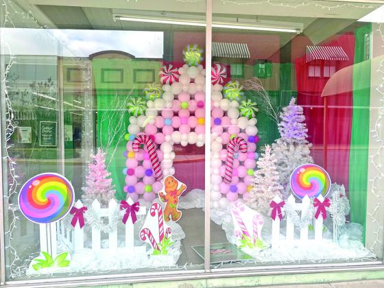 Bertrand’s Printing, located at 115 South 2nd St., was the winner of the ‘Deck the Doors’ contest. The community-wide holiday door and window decorating competition event was sponsored by Eunice Main Street. (Submitted photo)