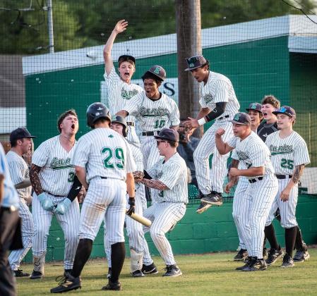 Eunice High team celebrates a playoff victory Thursday evening in their home contest. (Photo by Dwight Jodon)