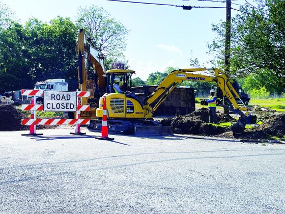 Contract workers on LA. 13 replacing cross drain. (Photo by Misty Gilley)