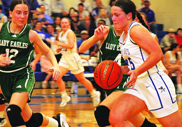 St. Edmund’s Millier Miller drives with the ball past Ouachita Christian Lady Eagles defenders. The Lady Jays lost 41-39 in a game that went down to the sire and ended their season. (Photo by Rhett Manuel)