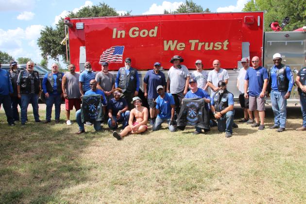 Thin Blue Line infront of firetruck