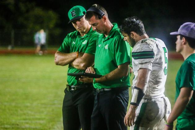 Eunice High head football coach Andre Vige and aisstant coach Stuart Turrner look at plays with quarterback Josh Brown during the  Bobcats’ 46-22 win over LaGrange. (Photo submitted by Barry Spears)