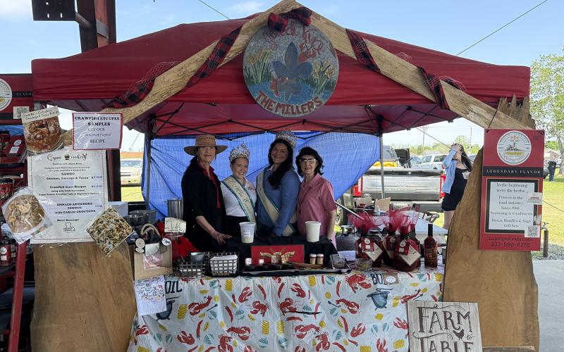 Cajun Prairie Signature Foods placed third in Crawfish Etouffee Cook-off Showmanship/Booth Decoration. From left are Myrna Miller, Teen Miss Eunice Gracie Lou Oliver, Miss Eunice Samantha Gobert and Joann Miller.