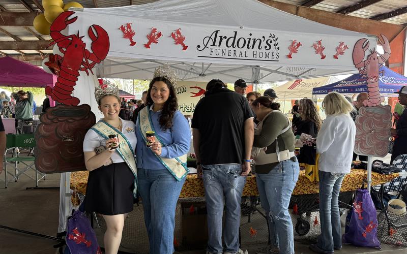 Ardoin’s Funeral Home placed second in Crawfish Etouffee Cook-off Showmanship/Booth Decoration. From left are Teen Miss Eunice Gracie Lou Oliver and Miss Eunice Samantha Gobert.