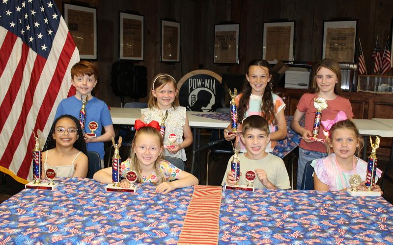 The Veterans of Foreign Wars Post 8971 and the Ladies Auxiliary sponsor Americanism essay contests each year. Winners were named, and cash awards and trophies were presented. Seated, from left, are Charli Rose Papillion, Ruby Bischoff, Case Chapman and Evelina Miller. In back from left are Bryce Duplechain, Rhyn Daggett, Ayda Fuselier and Amelia Daggett. Not pictured are Maxwell Andrepont, Andrew Brown, Lily Briscoe and James Miller.