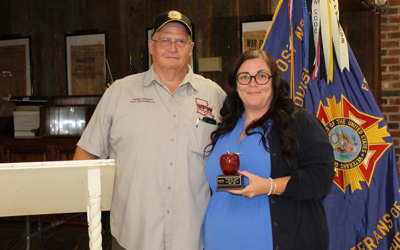 VFW Post 8971 and Ladies Auxiliary sponsor Americanism essay contests each year. Winners were named, and the Teacher of the Year was honored and recognized. Donnie Fontenot, post quartermaster, presents an award to Samantha Ortego, Eunice Jr. High Teacher of the Year. (Photo by Myra Miller)