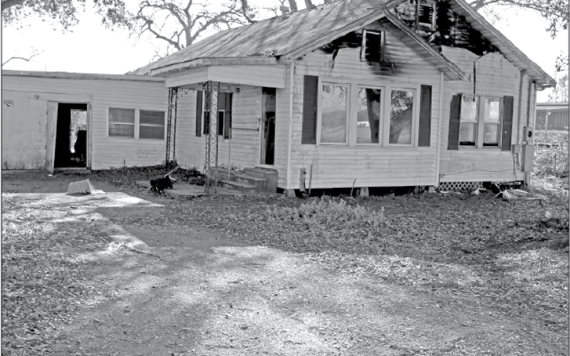 Eunice fire fighters were called to a structure fire at 152 East Ardoin at 4:14 p.m. Friday. According to Eunice Fire Chief Chaise Brown, “The home was unoccupied. It is located next door to Guillory Oil storage tanks.” The cause of the fire is under investigation. (Photo by Myra Miller)