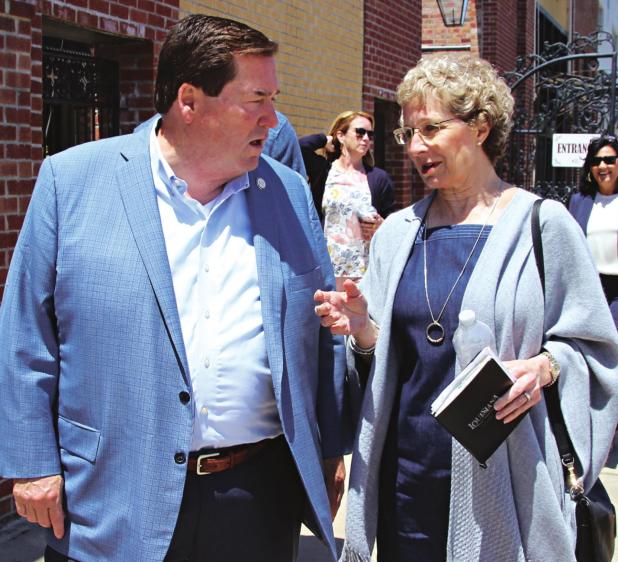 Lt. Gov. Billy Nungesser and Celeste Gomez walk on 2nd Street to the Liberty Theatre on Wednesday. Nungesser said he will help with a restoration project. (Photo by Myra Miller)