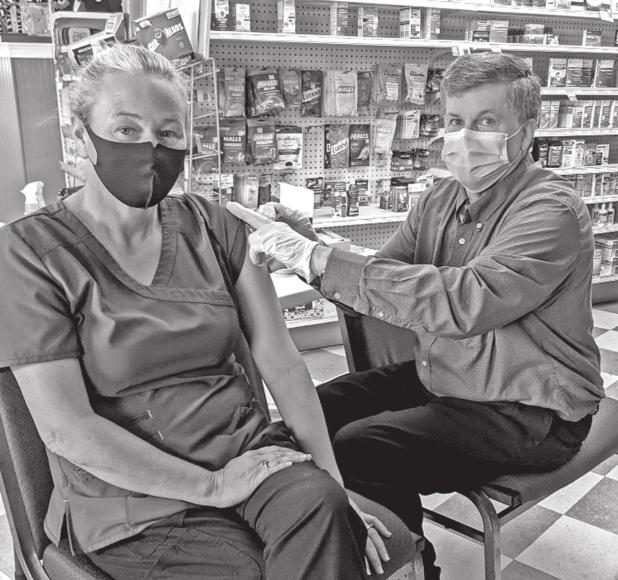 Randy Creel administers a COVID-19 vaccine dose at Creel’s Family Pharmacy in Franklinton. (Photo courtesy of Randy Creel)