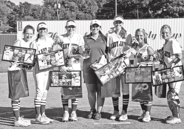 From left, the St. Edmund seniors are Hannah Benoit, Sarah Duplechain, Rebecca Benoit, head coach Lacey LaGrange, Anna Belle Fontenot, Mary Beth Lafleur, Rebecca Benoit and Jacey Cobb. (Photo by Tom Dodge)