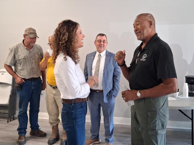 Letlow speaks with parish council member Jimmie Edwards.