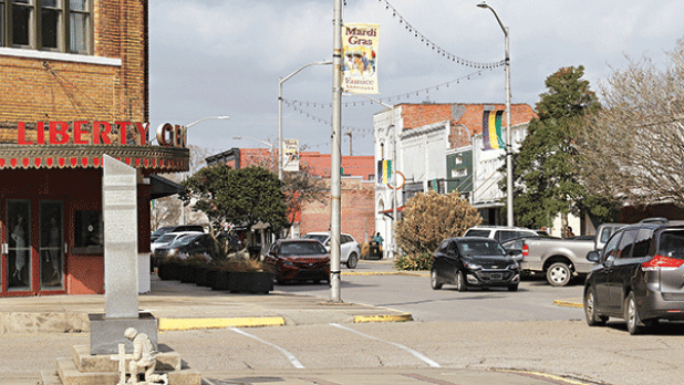 The Mardi Gras banners are up on 2nd Street in Eunice. Mardi Gras arrives on Feb. 21. (Photo by Harlan Kirgan)