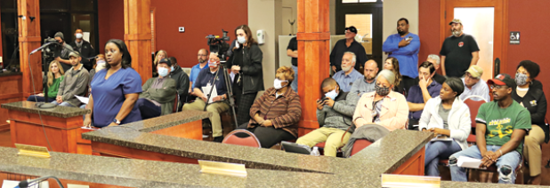 The audience at Wednesday’s St. Landry Parish Council meeting Opelousas was mostly filled with people interested in a barricade in a subdivision south of Opelousas. Speak, in blue, is Alexis Thomas of the subdivision. (Photo by Harlan Kirgan)