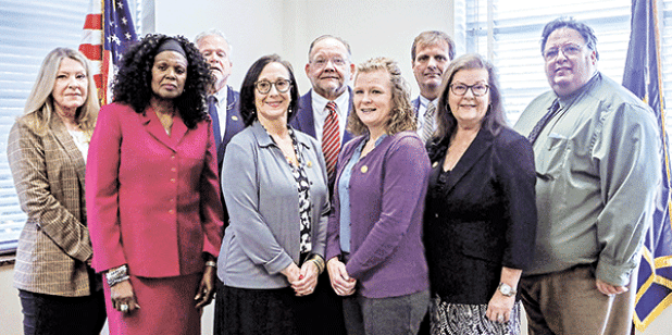 Acadia Parish Assessor James J. “Jimbo” Petitjean’s staff. Front, from left, are Nancy Hayes, Deborah Jackson, Lisa Faulk, Selina Myers, Cheryl Boudreaux and Joel O’Quain. Rear, from left, are Jeff Bourgeois, Jim Petitjean and Randy Guidry.(Submitted photo)