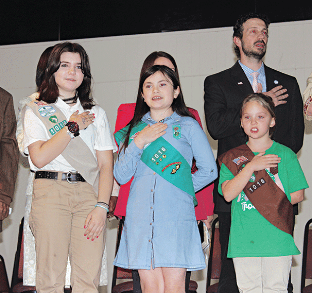 The Girl Scout Troop 1016 led the Pledge of Allegiance during the Inauguration Ceremony program held Thursday. From left, are London (L.J.) Hofstad, Ava Ortego and Kallie Bakka. Alderman Chad Andrepont is in the background.More photos on Page 10. (Photo by Myra Miller)