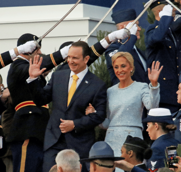 Gov.-elect Jeff Landry and how wife, Sharon, wave as they walk down the capitol steps on Sunday for the inauguration ceremony.(Photo by Harlan Kirgan)