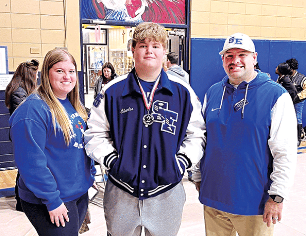 The Blue Jay’s Powerlifting team competed at the Sacred Heart Invitational on Saturday. SEH Junior, Charles Sonnier was second overall in the Super Heavy Weight division. He squatted 510 lbs, dead lifted 445 lbs. and broke the Super Heavy Weight meet record on bench at 305 lbs. He is with his sister, Laura Sonnier and Coach Corey Diaz. Photo by Dusty Sonnier)
