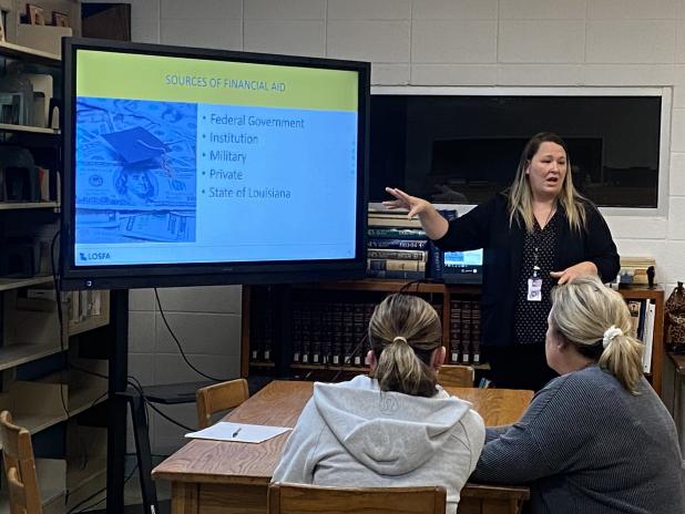 April Smith, public information officer with the Louisiana Office of Student Financial Assistance (LOSFA), spoke to students and parents on how to qualify for LA TOPS scholarship awards, the different levels of TOPS awards, how to keep TOPS awards in college, financial aid, other scholarships, and on completing the free application for Federal Student Aid (FAFSA).