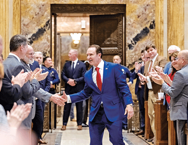 Gov. Jeff Landry shakes hands with Louisiana lawmakers while entering the State Capitol’s House chamber on Jan. 15, the first day of a special session on redistricting and election matters. (Michael Johnson/The Advocate, Pool)