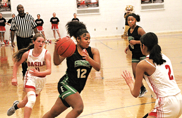 Eunice’s KeKe Monday drives to the hoop during Tuesday’s 45-33 loss to the Basile Lady Bearcats. Monday led all Bobcat scorers with 12 points, while Kyndrea Frank added nine points.
