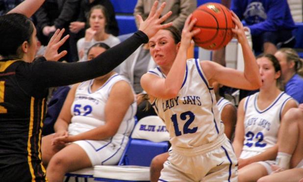 St. Edmund girls basketball team won in over time against Grand Lake Tuesday. Above is St. Ed senior Caroline Lavergne. (Photo by Rhett Manuel)